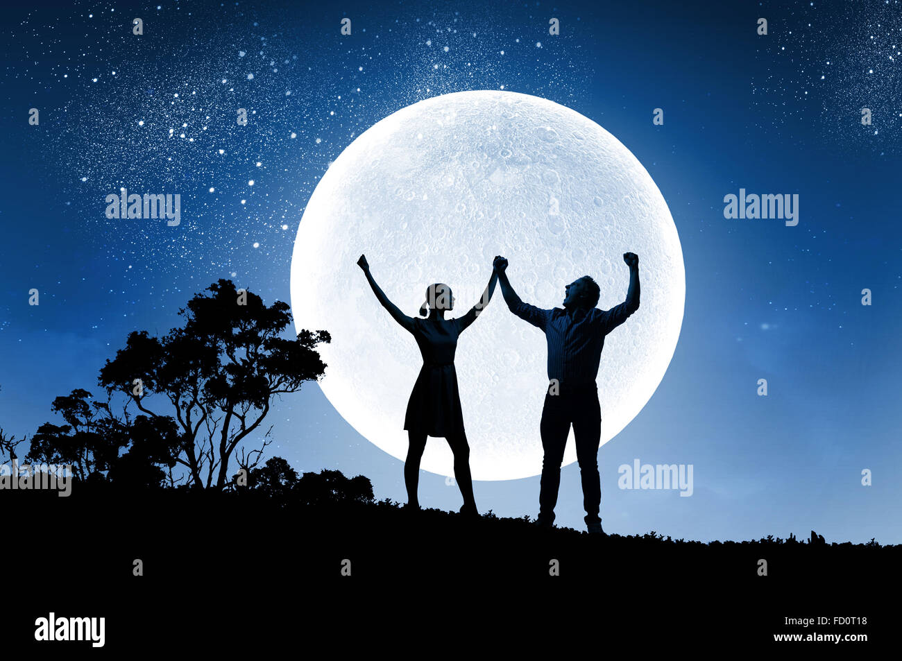 Silhouettes of young couple against full moon Stock Photo - Alamy