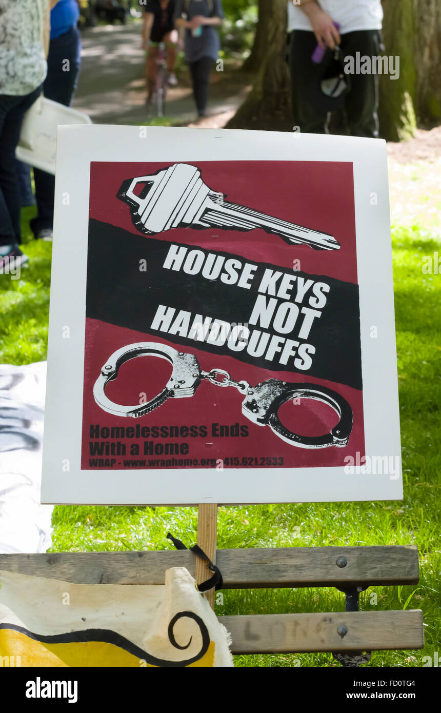 Protest sign 'House Keys Not Handcuffs' supports homeless people in Portland, Oregon looking for permanent housing solutions. Stock Photo