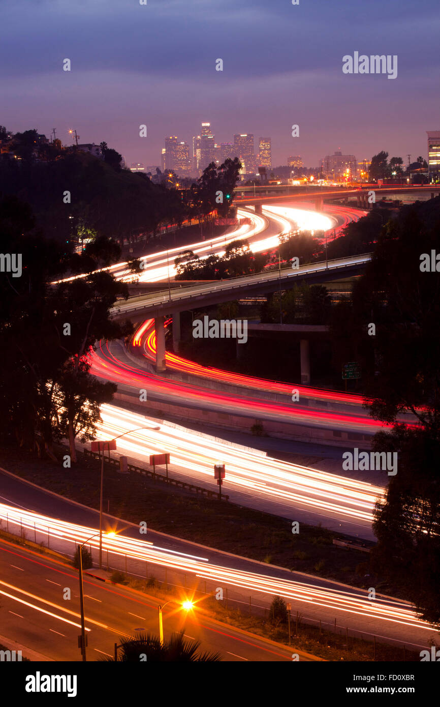 The 10 and 710 Freeway interchange seen from an aerial view and in the distance the Los Angeles skyline.  Los Angeles, Californi Stock Photo