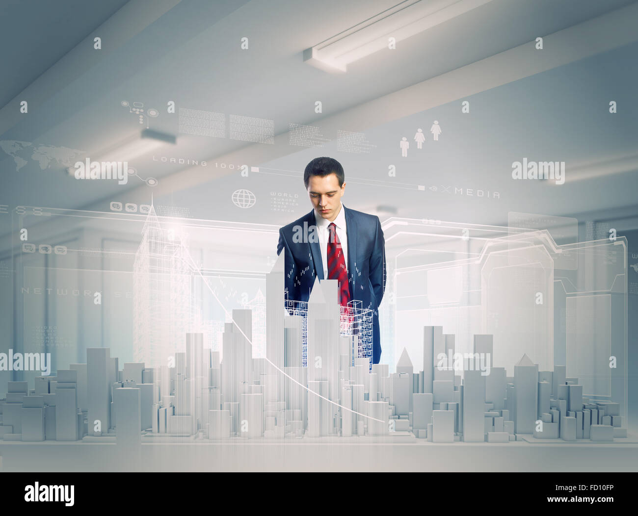Young businessman examining model of construction project Stock Photo ...