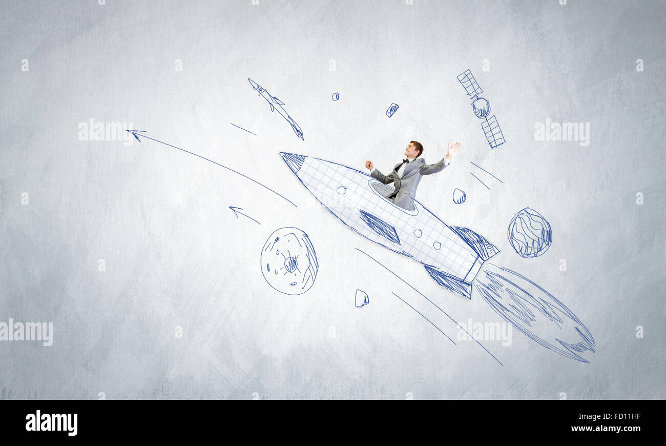 Young businessman flying in sky on drawn rocket Stock Photo - Alamy