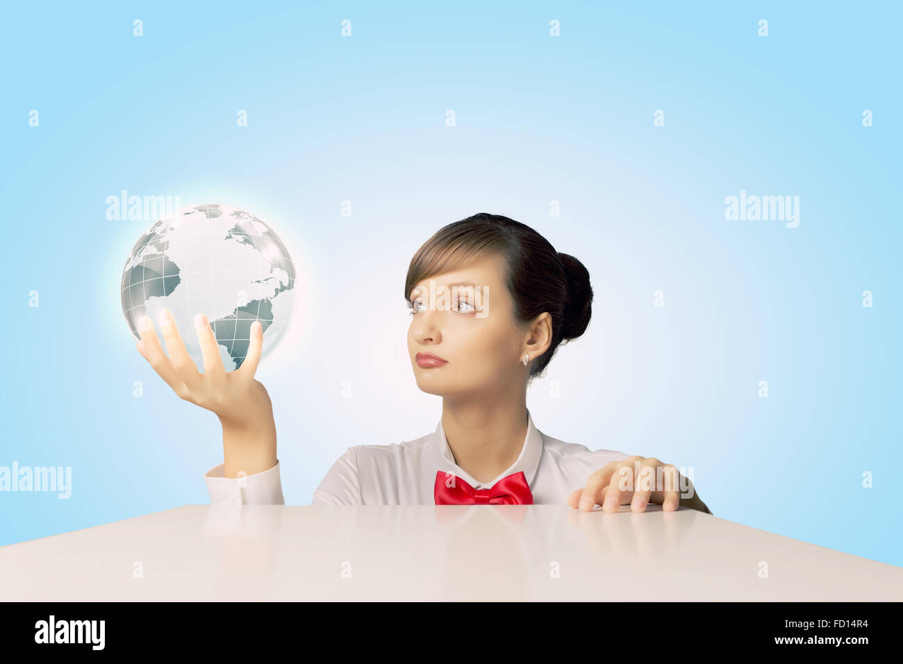 Young woman holding digital Earth planet in hand Stock Photo - Alamy