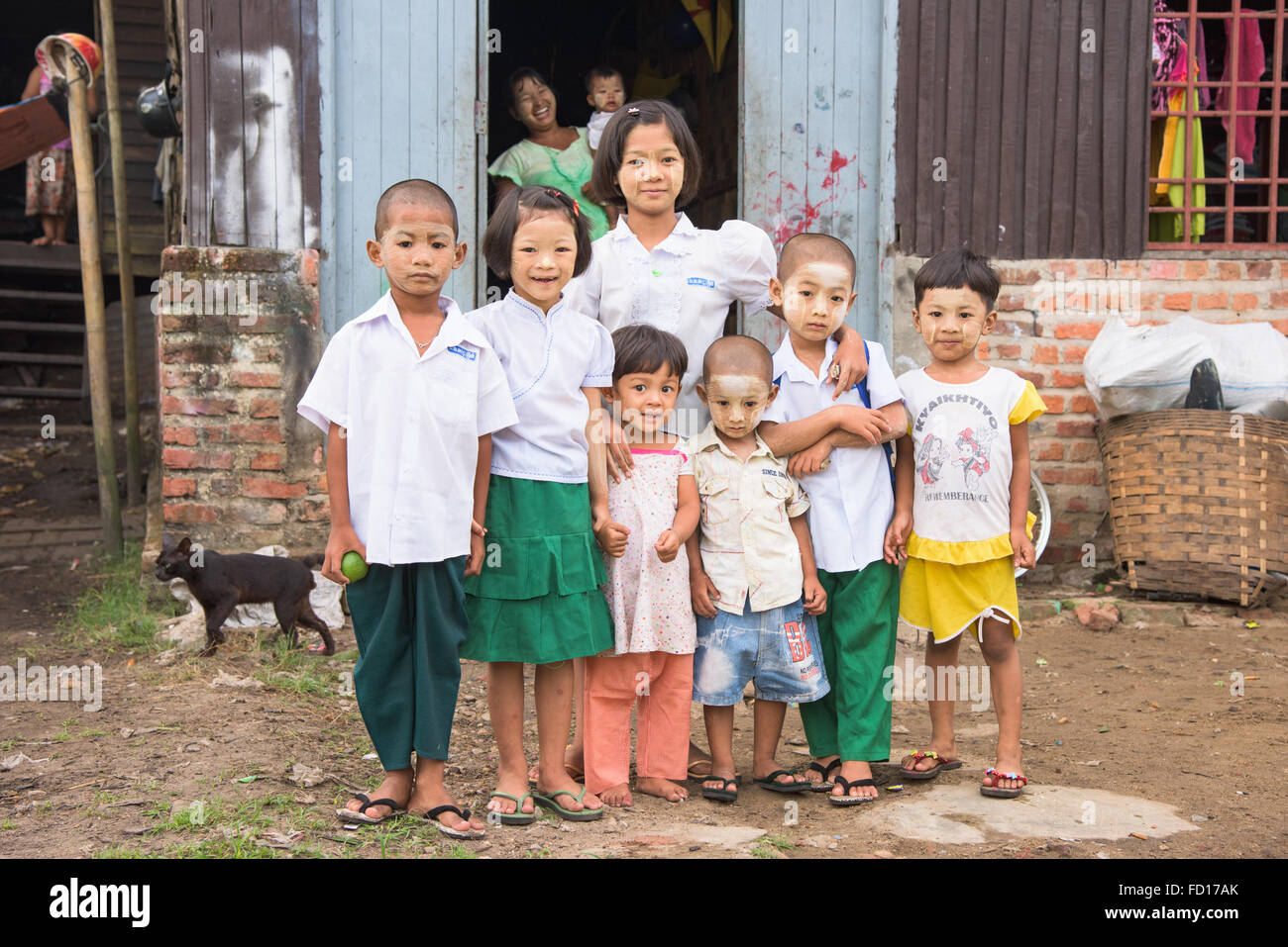 Children, four of them in school uniform and ready for school in the