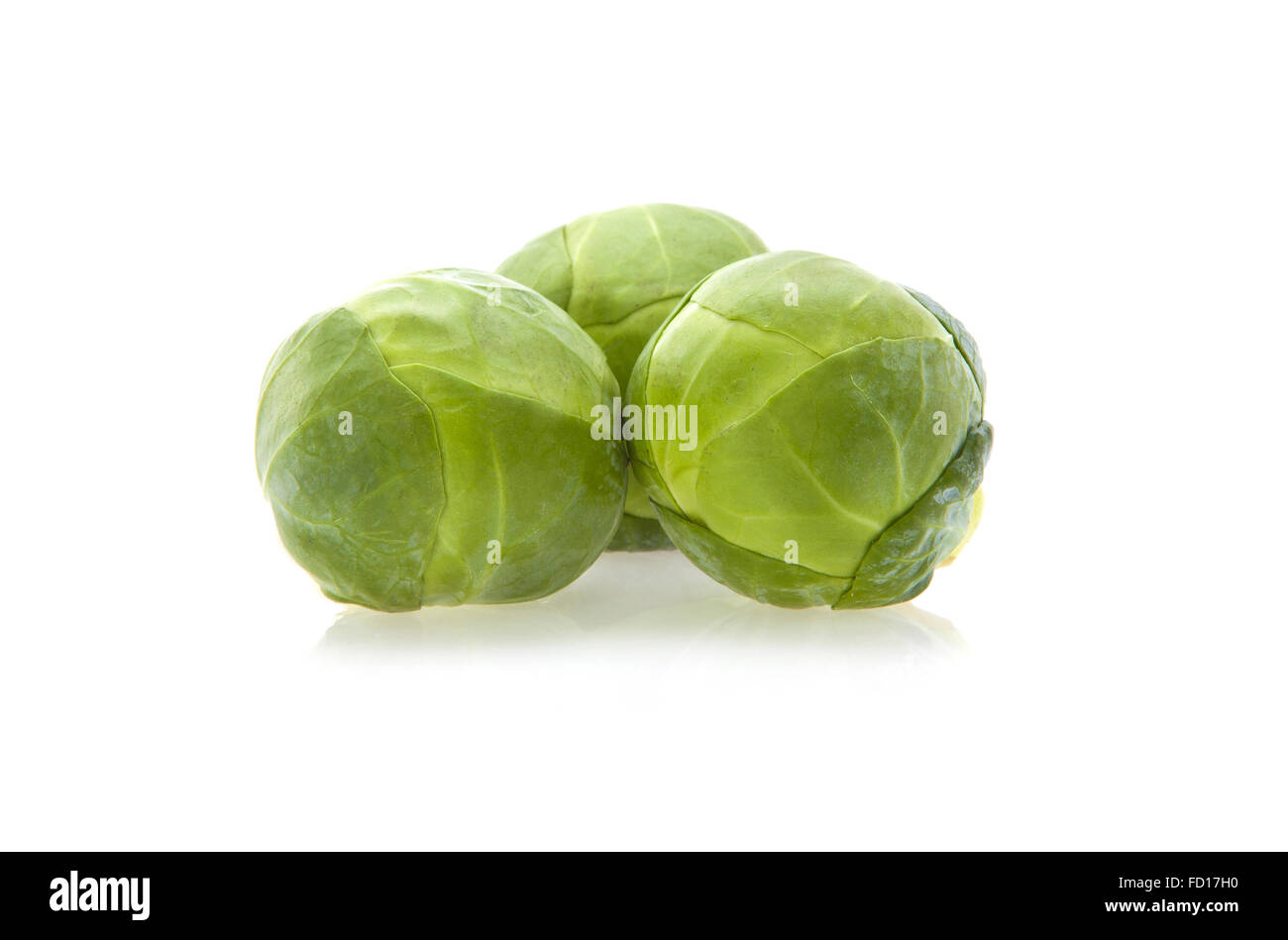 Fresh organic Brussel sprouts isolated on white Stock Photo