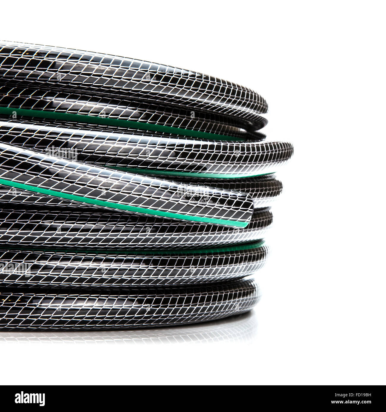 Rolled garden hose isolated on white Stock Photo