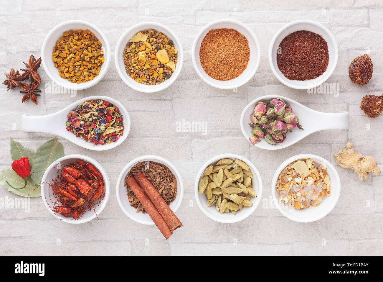 Various spices in small bowls. A collection of ground and whole spices Stock Photo