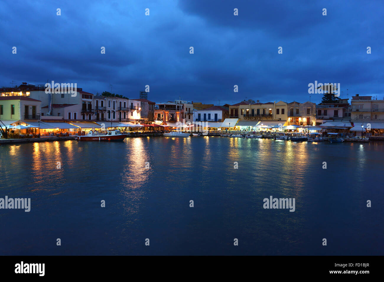 Harbor and old town Rethimno with restaurants at dusk, island Crete ...