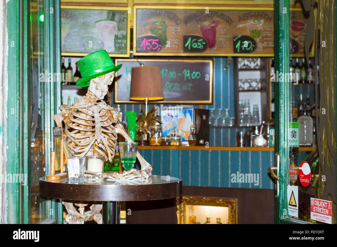 PRAGUE, CZECH REPUBLIC - AUGUST 27, 2015: The layout of a skeleton sitting at a table in the bar, Prague, Czech Republic Stock Photo