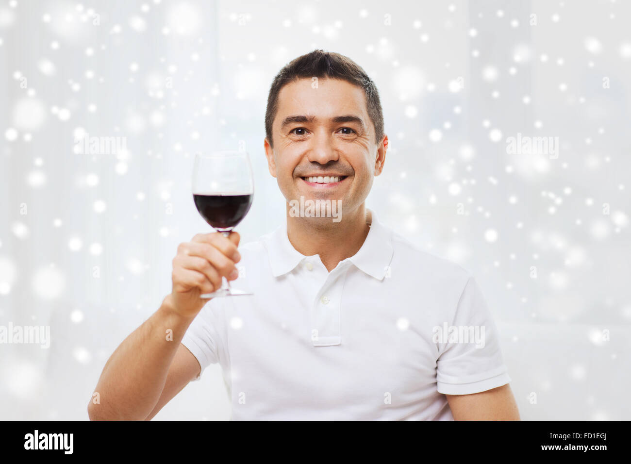 happy man drinking red wine from glass at home Stock Photo - Alamy