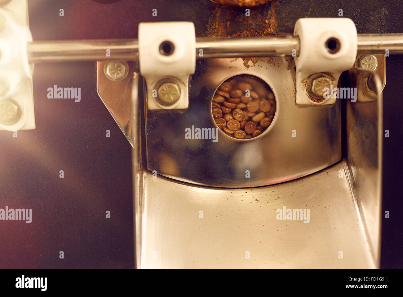 Window detail on a modern coffee bean roasting machine Stock Photo