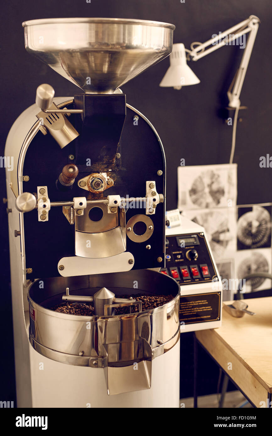 Modern coffee bean roasting machine with shiny metal parts Stock Photo