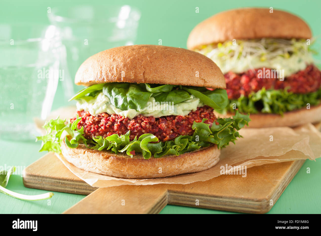 veggie beet and quinoa burger with avocado dressing Stock Photo Alamy