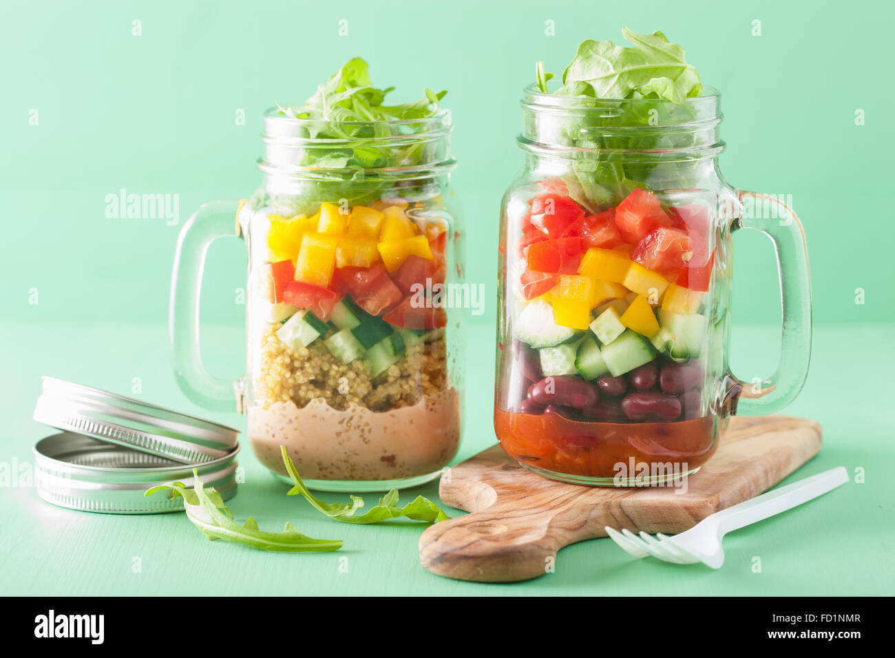 vegan quinoa bean vegetable salad in mason jars Stock Photo Alamy