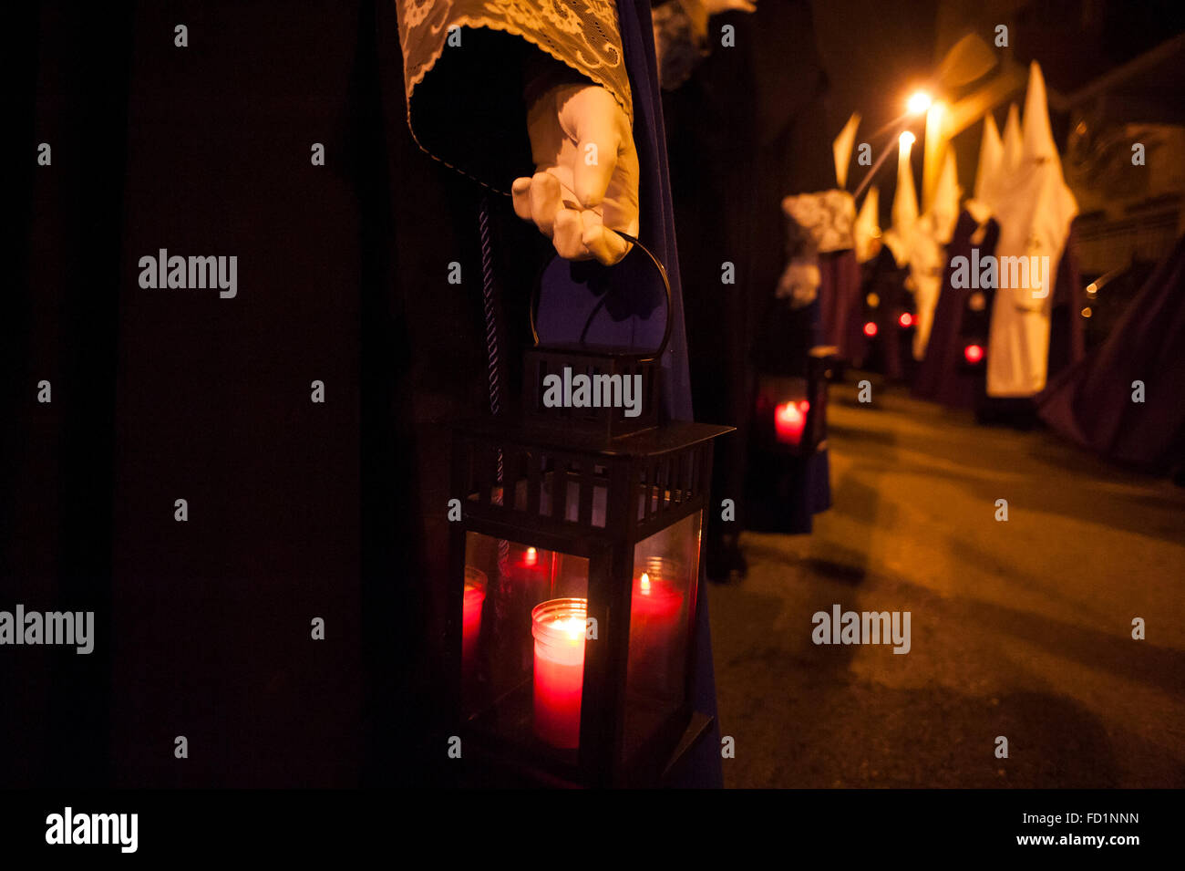 The Holy Monday night procession of the christ of Prayer is done with candles is done. Stock Photo