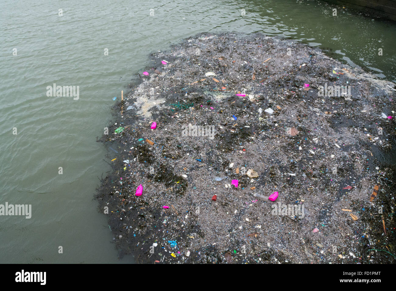 Porthleven Harbour, Cornwall, UK. 27th January 2016.  Storms continue to wash in marine litter into Cornwall's coast. Seen here more Vanish detergent bottles which have littered a wide area of coastline over the last few weeks. Credit:  Simon Yates/Alamy Live News Stock Photo