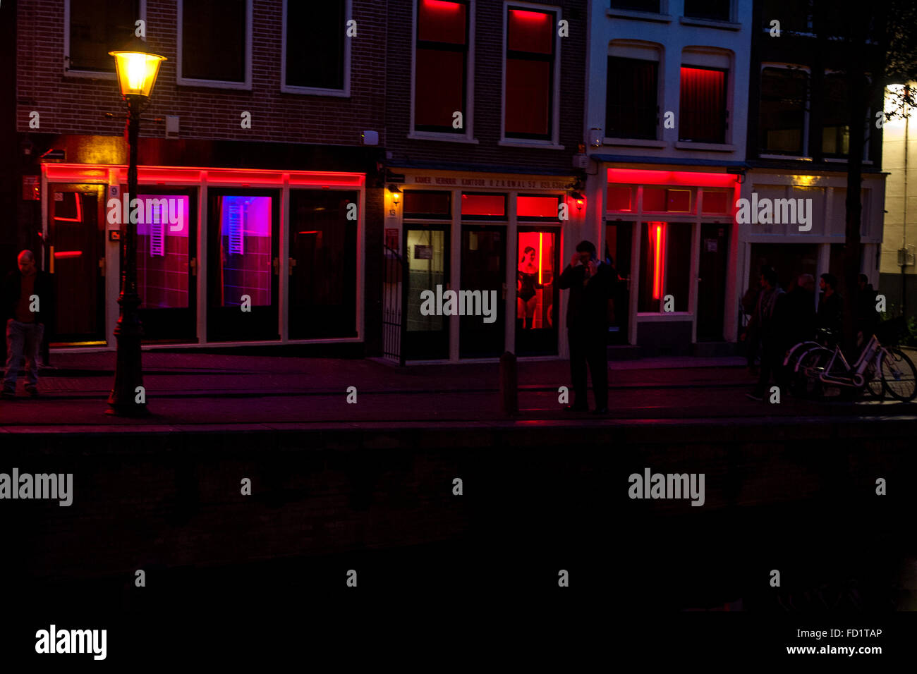 Rosse Buurt (The red light district) of Amsterdam is famous for their  windows with prostitutes, since this activity is legalized Stock Photo -  Alamy, image size:1300x956