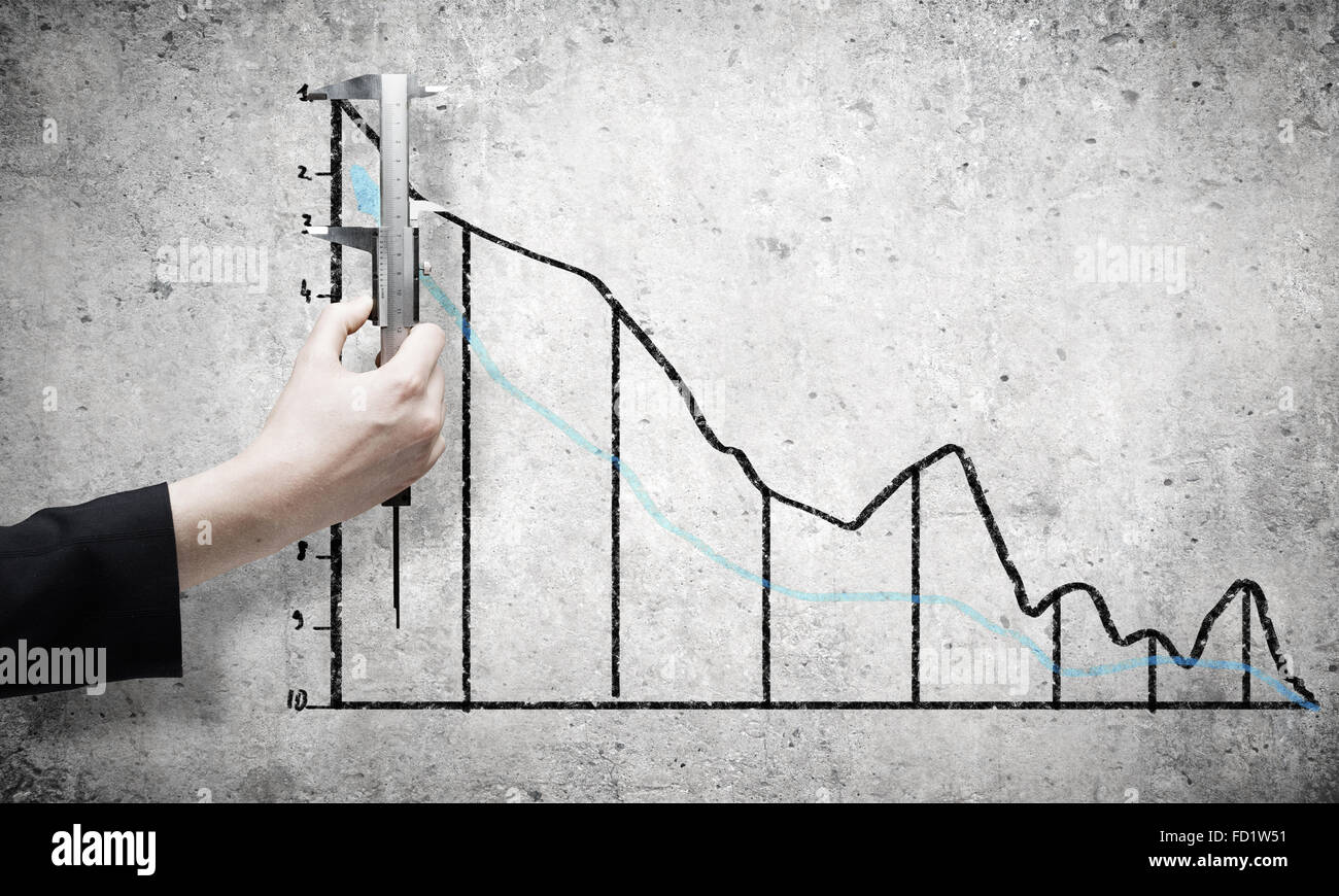 Close up of female hand measuring graph with ruler Stock Photo - Alamy