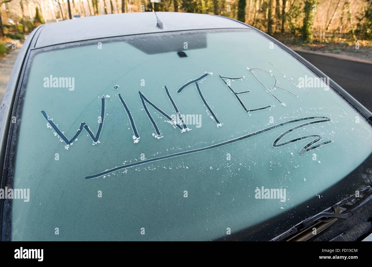The word winter written on a frozen car windscreen Stock Photo