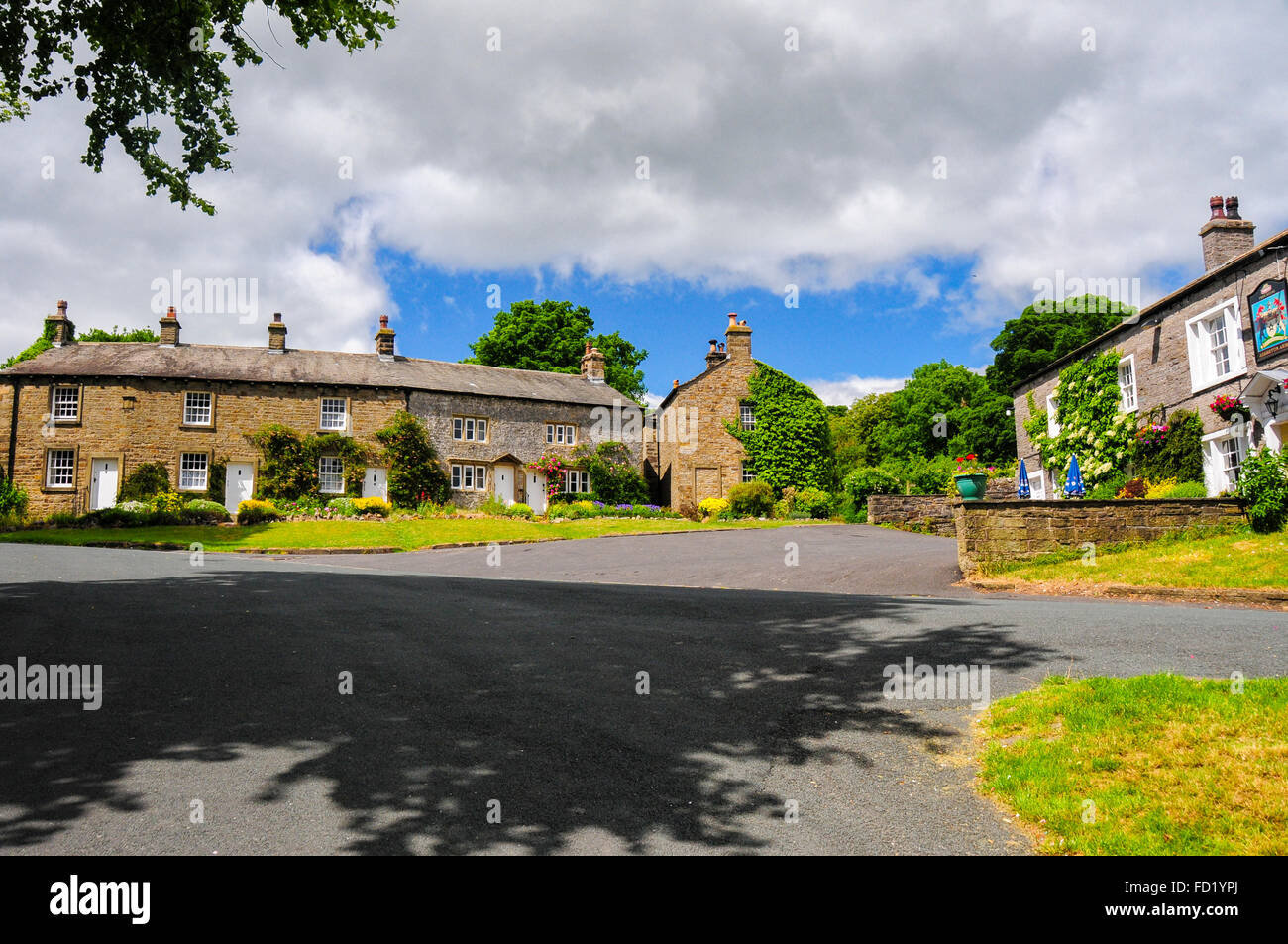 Old Stone Cottages and The Assheton Arms Hotel. Downham Village, Lancashire, - Historic County Palatine, United Kingdom, Stock Photo