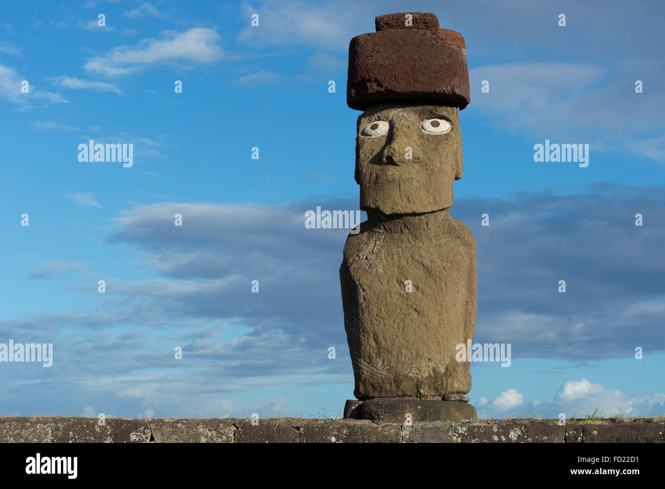 Moai wearing a Pukao (Topknots), Hanga Roa, Rapa Nui National Park, Easter Island, Chile, Unesco World Heritage Stock Photo