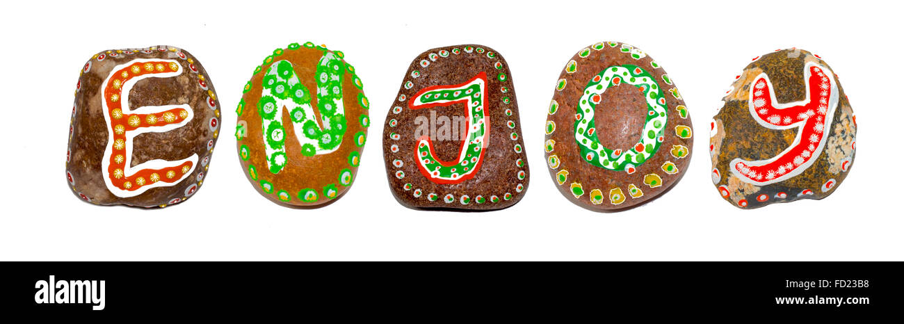 Enjoy word made of hand painted stones Stock Photo