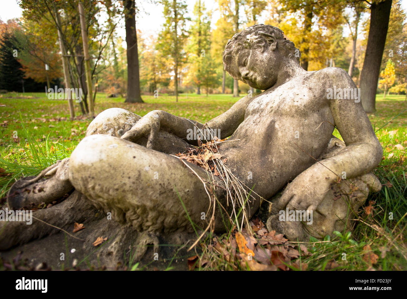 Europe, Germany, North Rhine-Westphalia, Lower Rhine Region, sculpture of a sleeping boy in a garden. Stock Photo