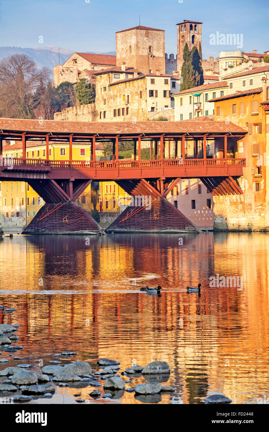 Famous old wooden bridge (Ponte Vecchio) in village Bassano del Grappa, Italy Stock Photo