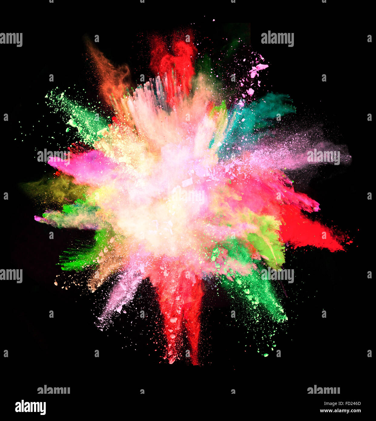 Colored powder explosion isolated on black background Stock Photo - Alamy
