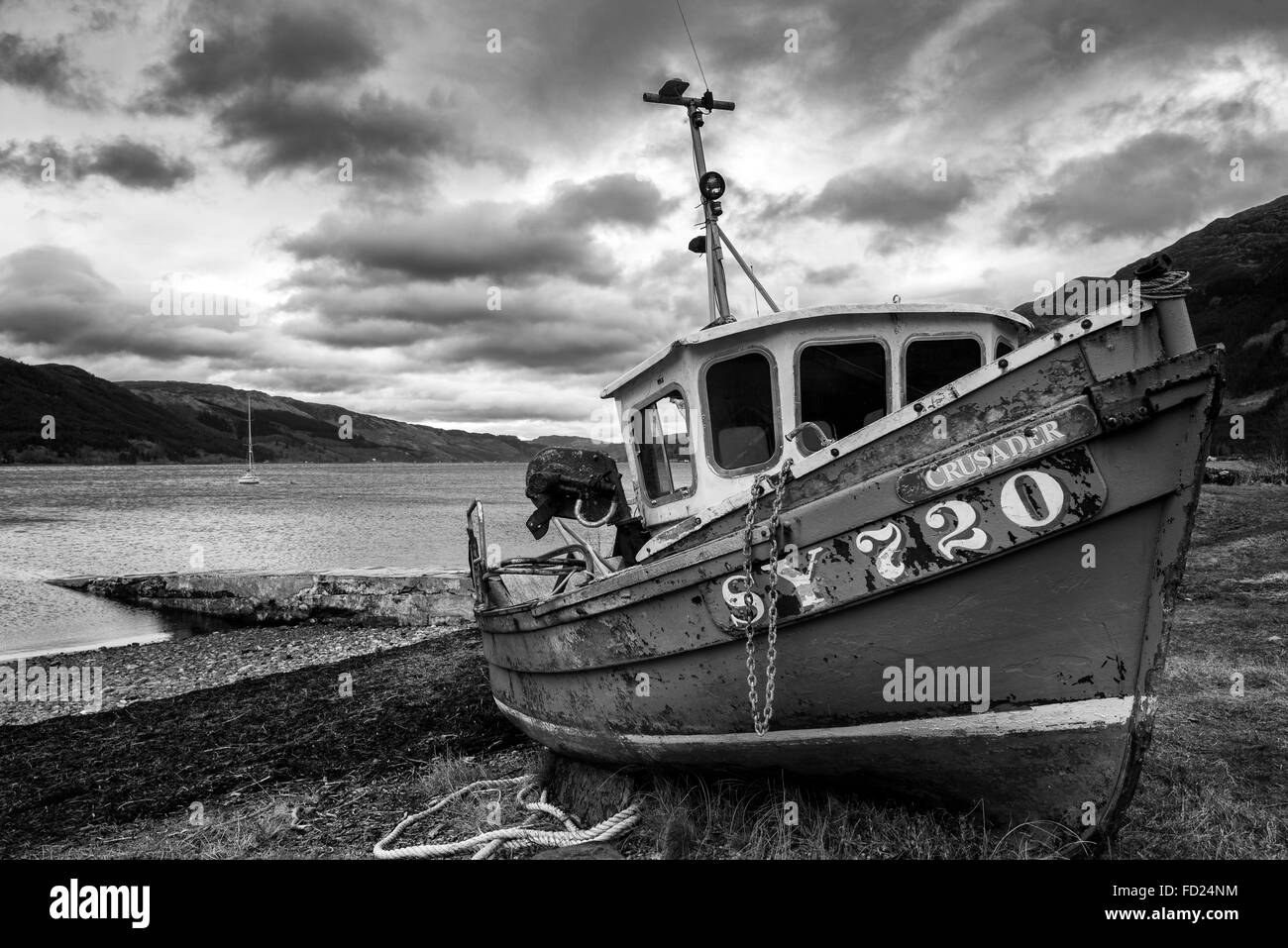 A boat on the beach at Invershiel, on the banks of Loch Duich in the Scottish Highlands, UK Stock Photo