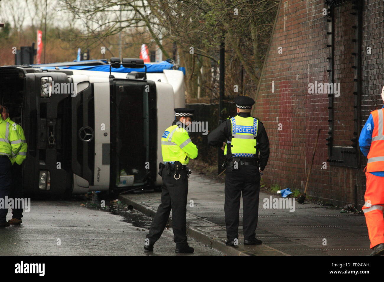 Swindon, England. 27th January, 2016. Recovery teams work to remove the