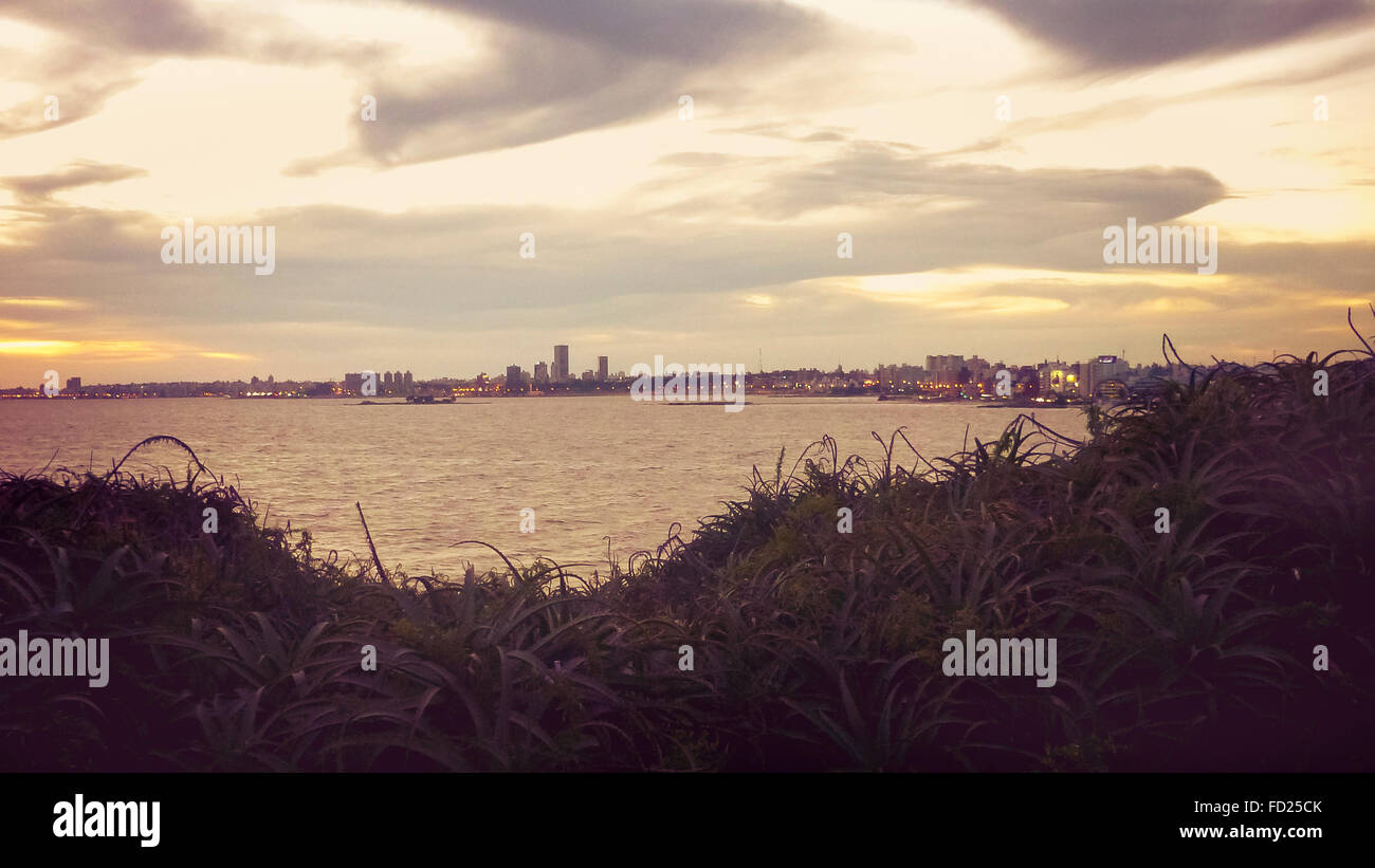 Color edited photo of river and skyline of Montevideo from landmark Virgilio square viewpoint. Stock Photo