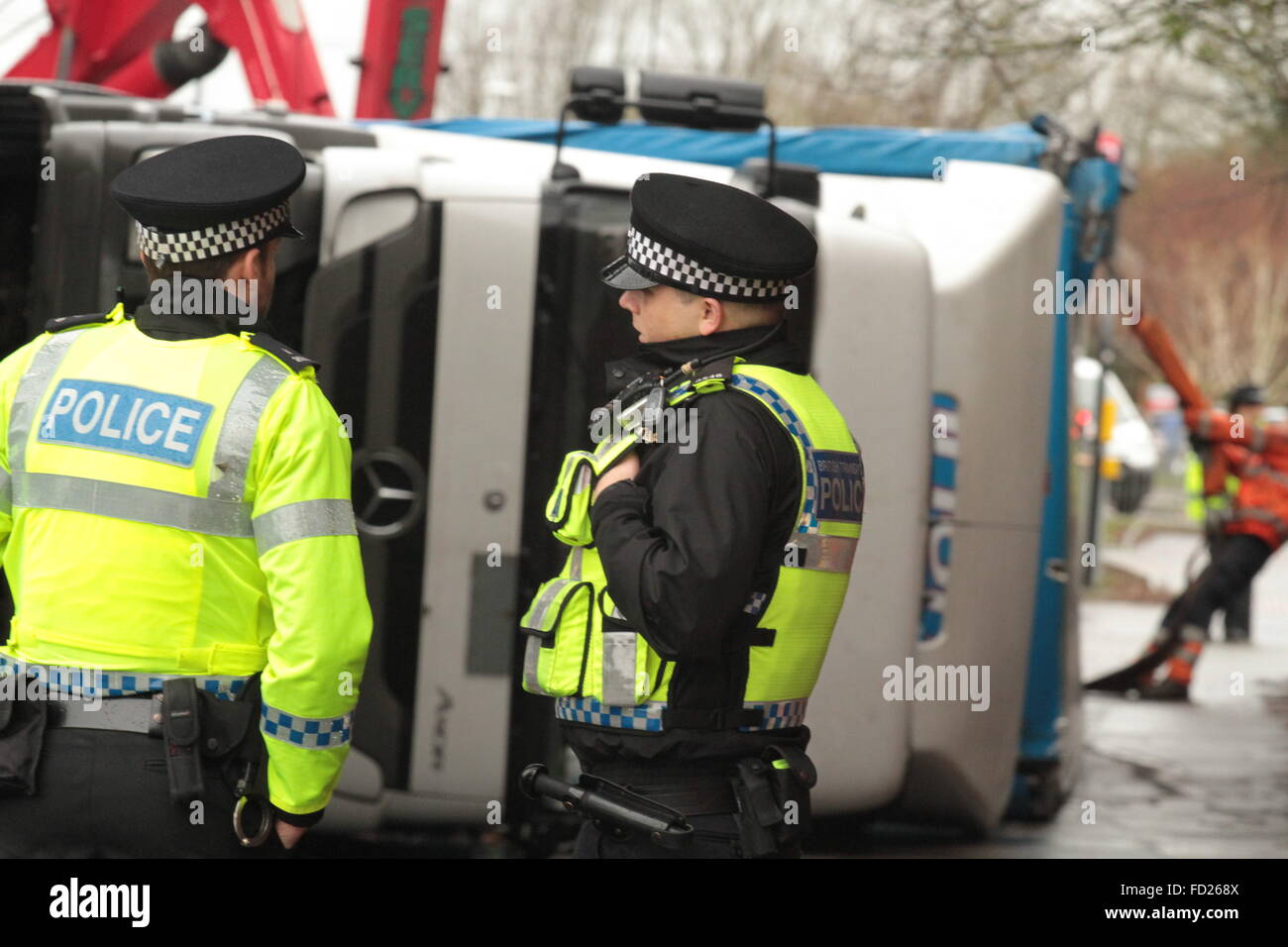 Swindon, England. 27th January, 2016. Recovery teams work to remove the