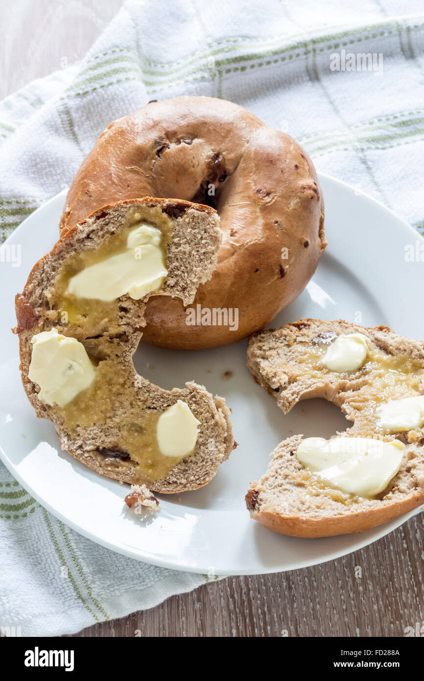 Two Toasted and buttered Cinnamon and raisin Bagels Stock Photo