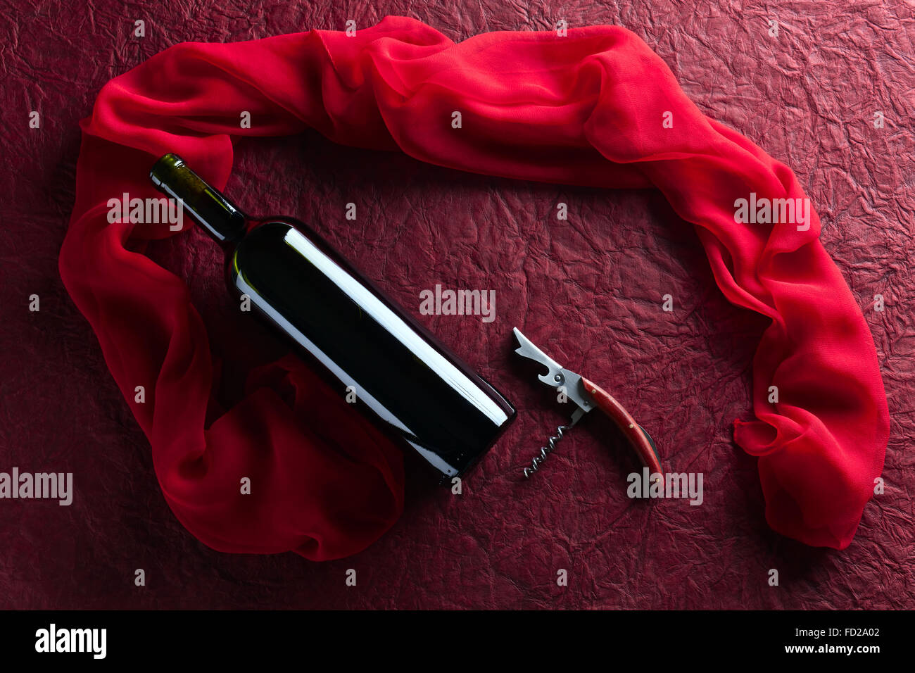 red wine bottle on a dark background Stock Photo - Alamy