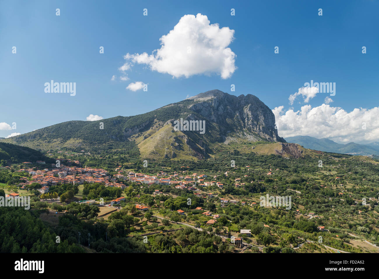The mountain range of Monte Bulgheria and the township of San Giovanni a Piro in Cilento in afternoon light,Campania,Italy Stock Photo
