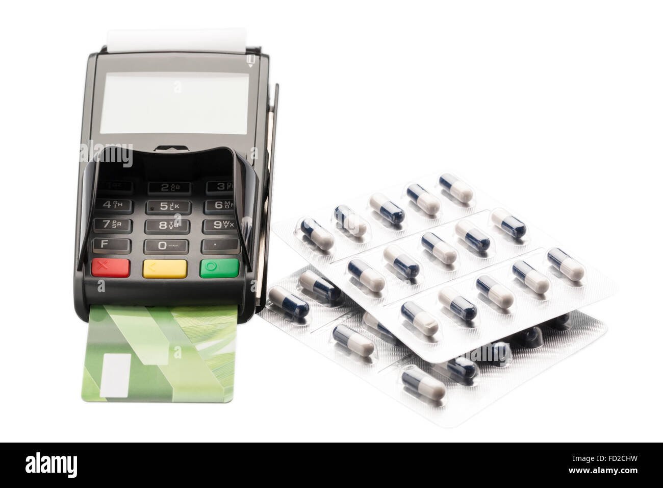 POS terminal, debit card and pill blister packs over white Stock Photo