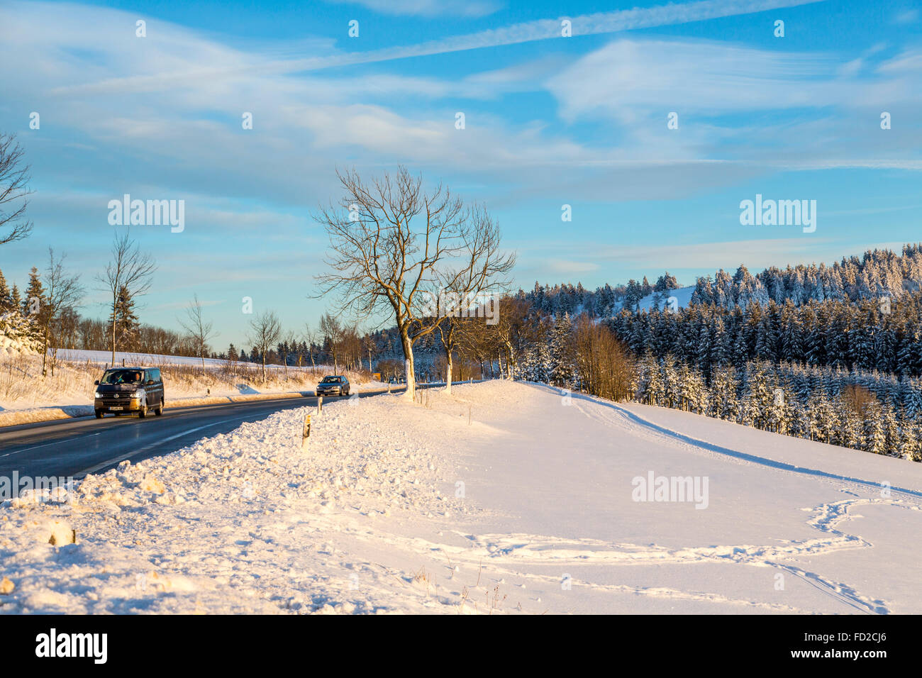 Winter, snowy landscape in the Sauerland area, Germany, country road, Stock Photo