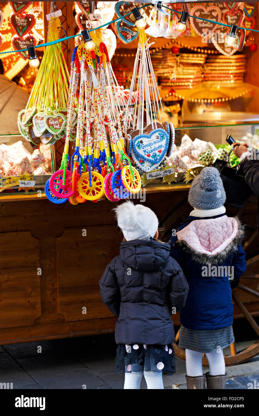 Children looking  at a  German Christmas markets stand, Munich, Upper Bavaria, Germany, Europe. Stock Photo