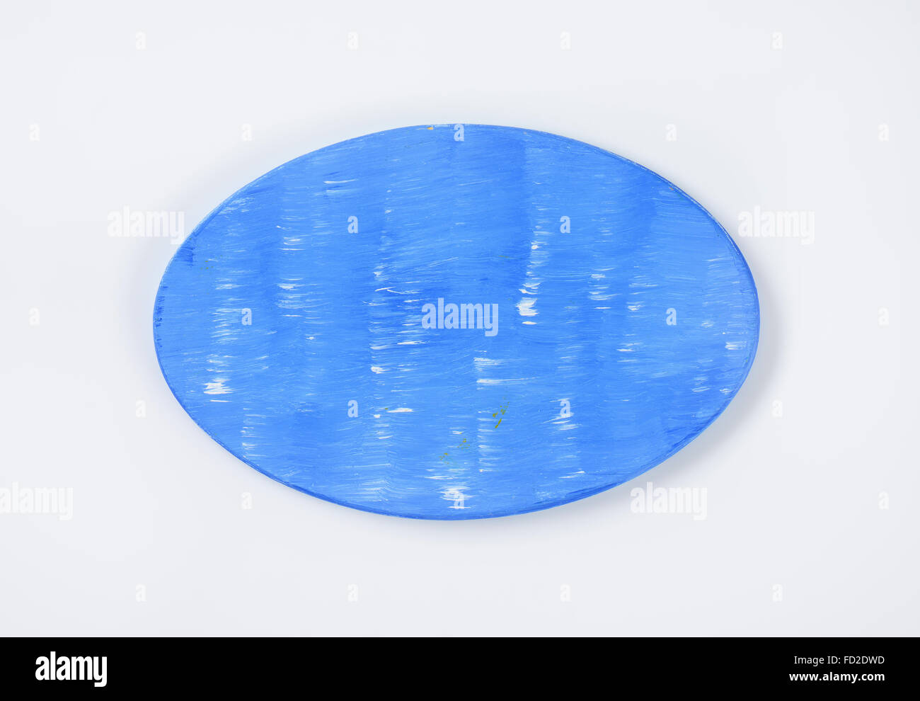 oval cutting board painted blue Stock Photo