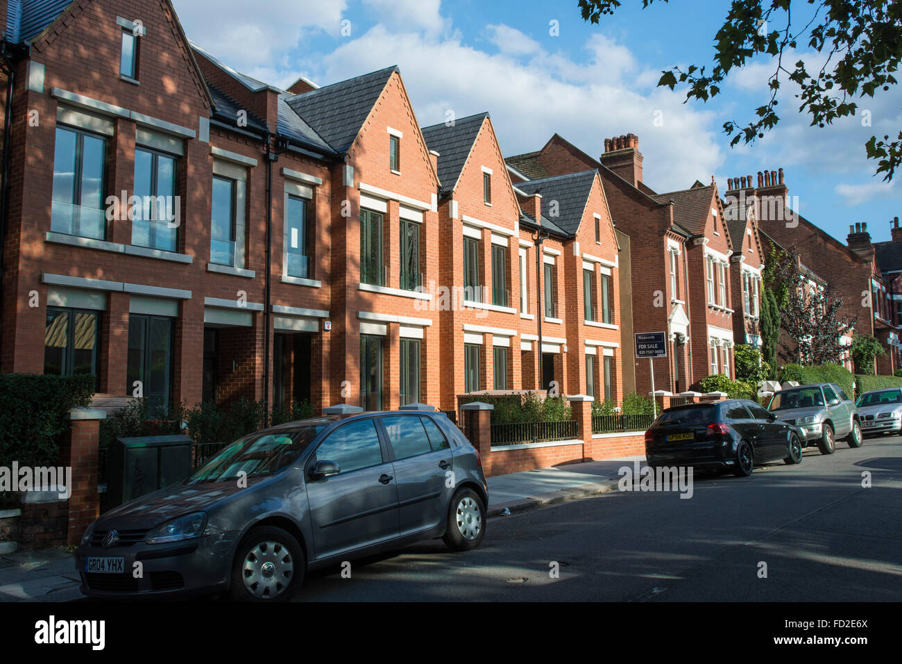 New houses at Calais Street, Myatts Field Park, Brixton, Lambeth, London – red brick terraced houses Stock Photo