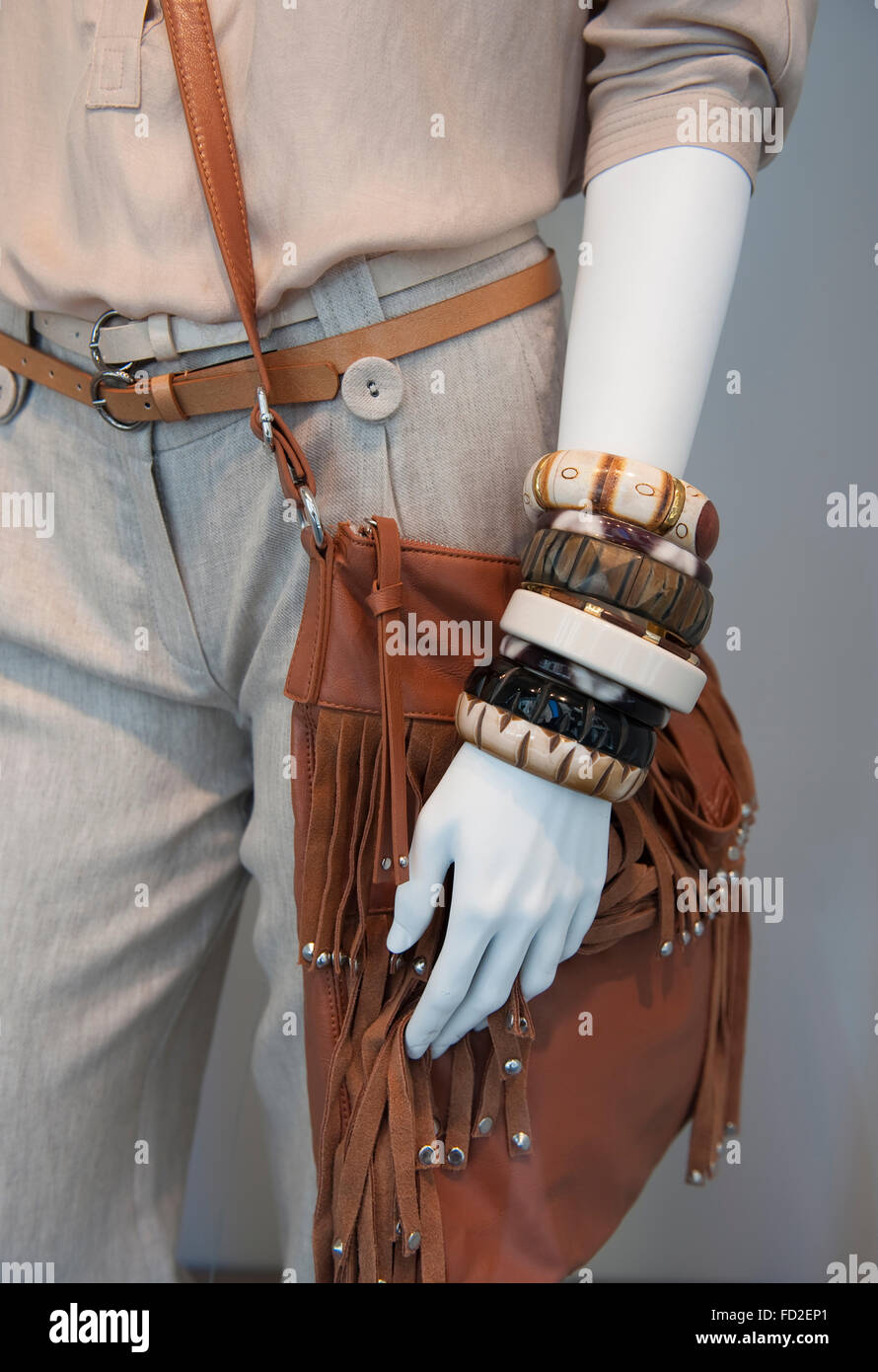 Leather bag,bracelets and belt on trousers Stock Photo