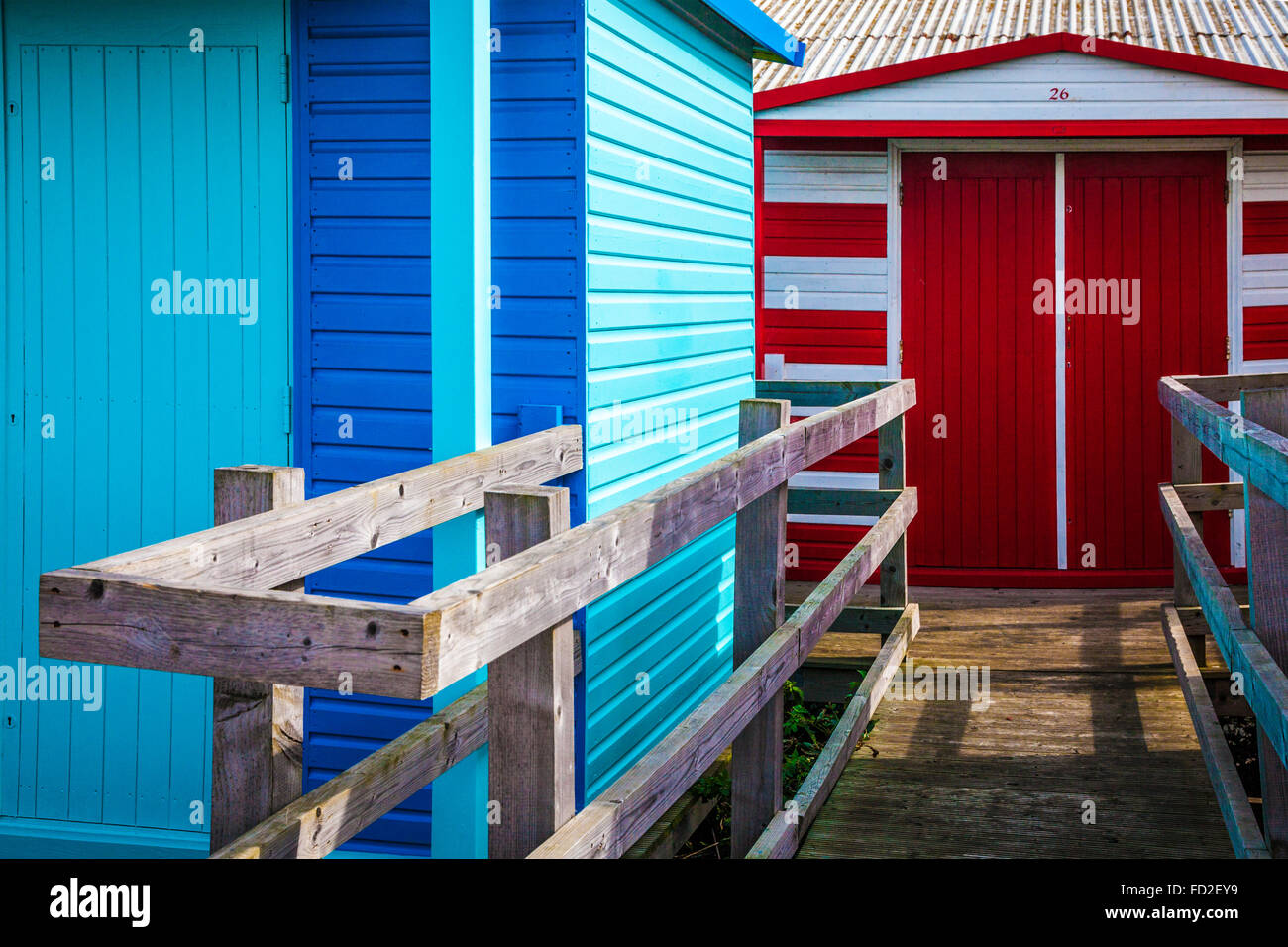 Colourful wooden beach huts in the Kentish coastal resort of Whitstable. Stock Photo
