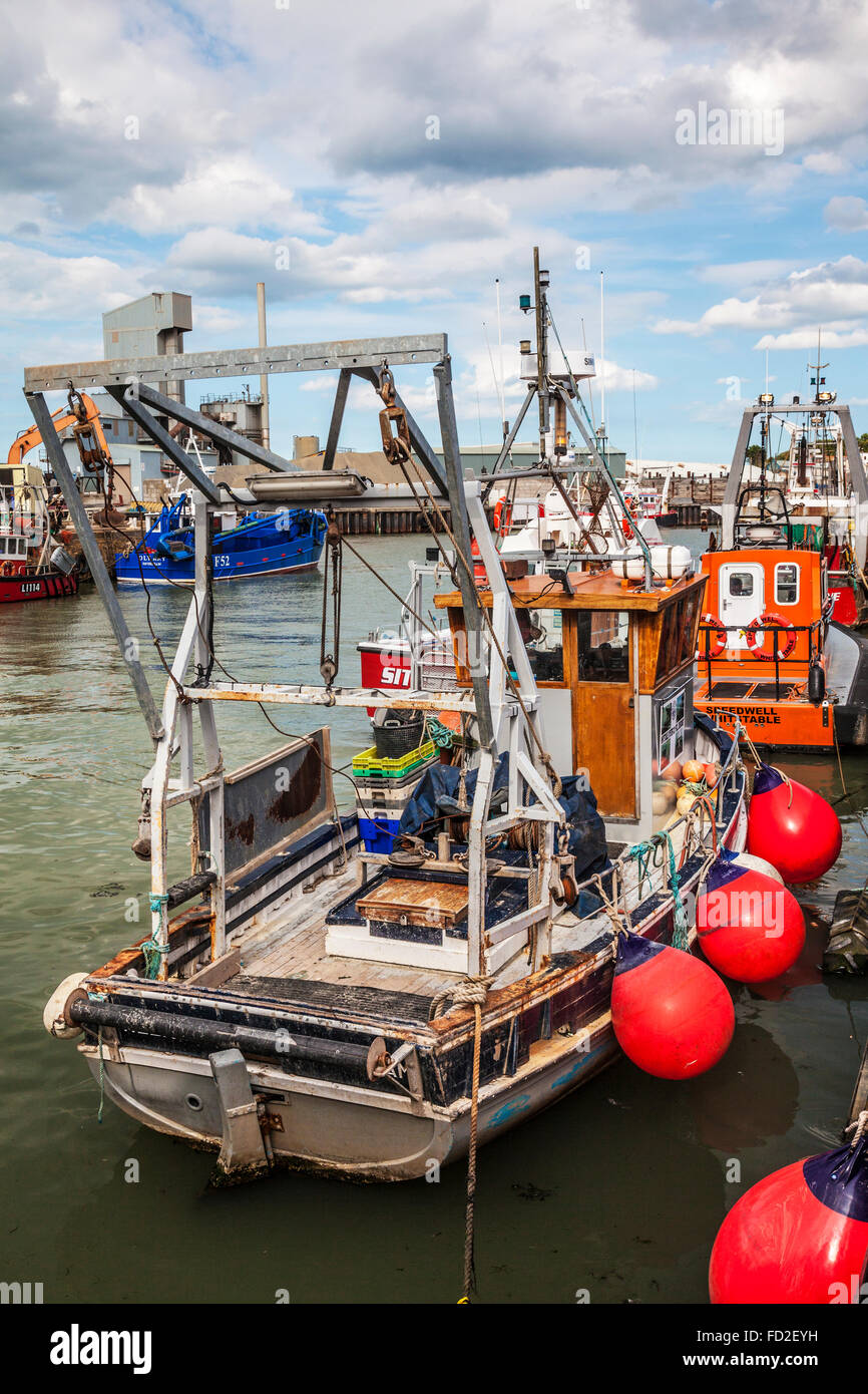 Fishing boats morred in the harbour in the Kentish coastal resort of Whitstable. Stock Photo