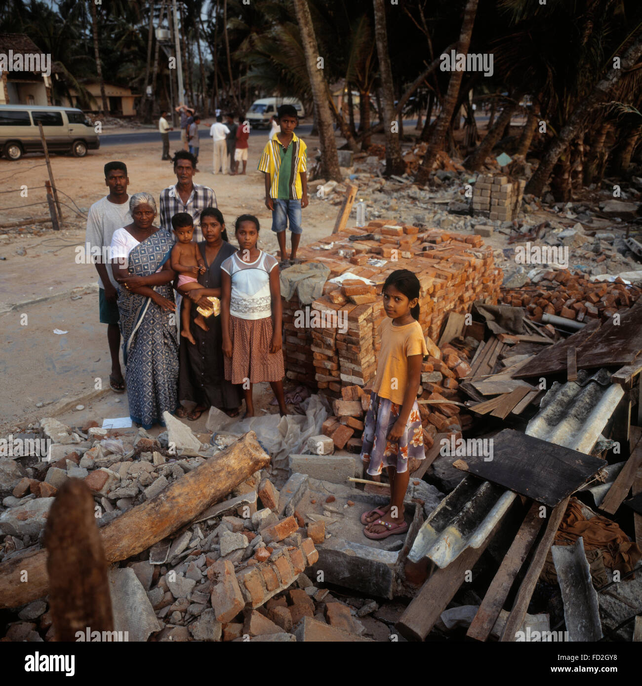 Families supported by Young's fish after the Tsunami that hit Beruwala Sri lanka. Stock Photo
