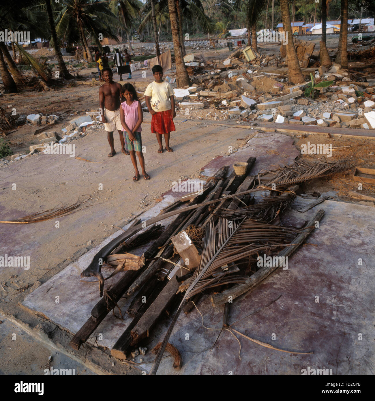 Families supported by Young's fish after the Tsunami that hit Beruwala Sri lanka. Stock Photo