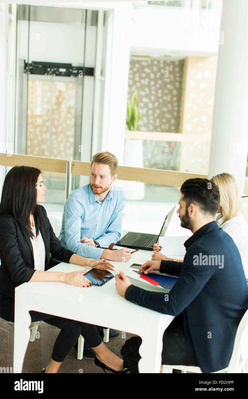 Young people working in the office Stock Photo - Alamy