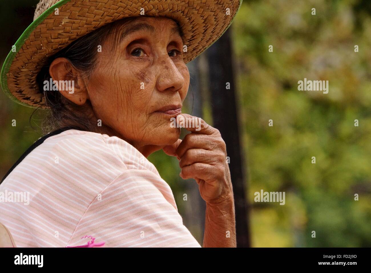 Mexican Lady watching the world go by. Stock Photo