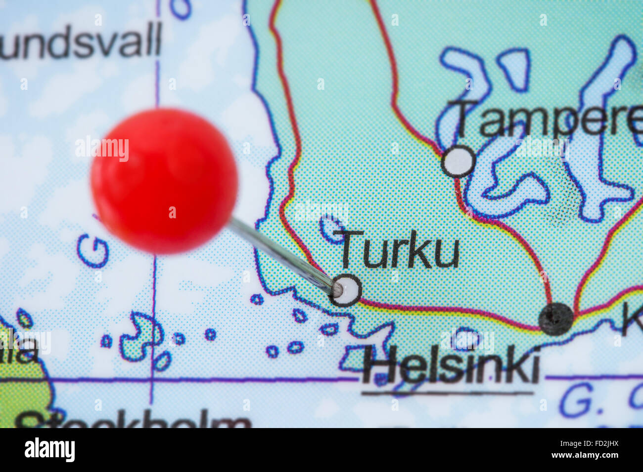 Close-up of a red pushpin in a map of Turku, Finland. Stock Photo