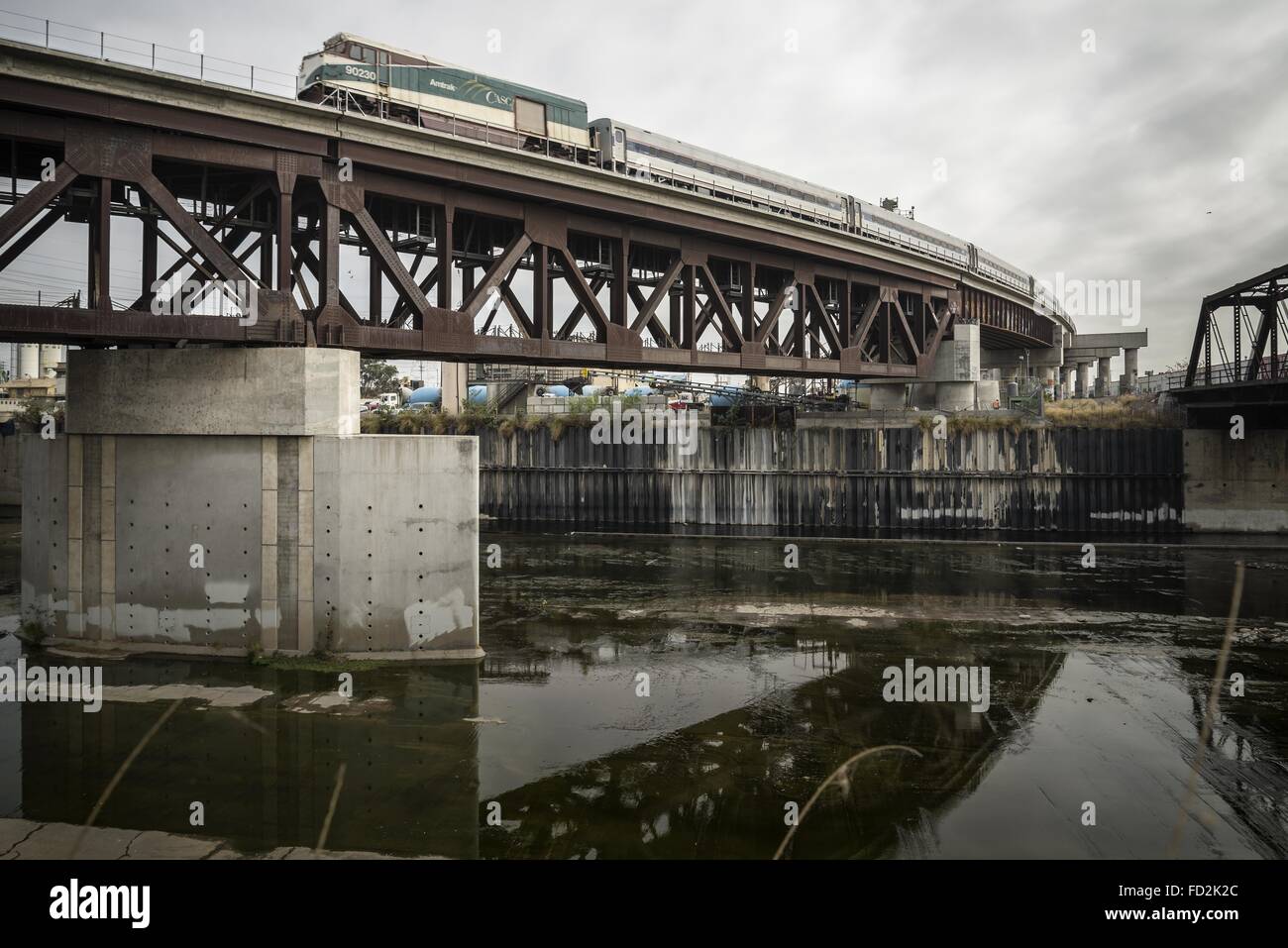 Dec. 4, 2015 - Los Angeles, California, U.S - A steel railroad bridge spans the LA River south of Main Street and carries light rail traffic out of Union Station. (Credit Image: © Fred Hoerr via ZUMA Wire) Stock Photo