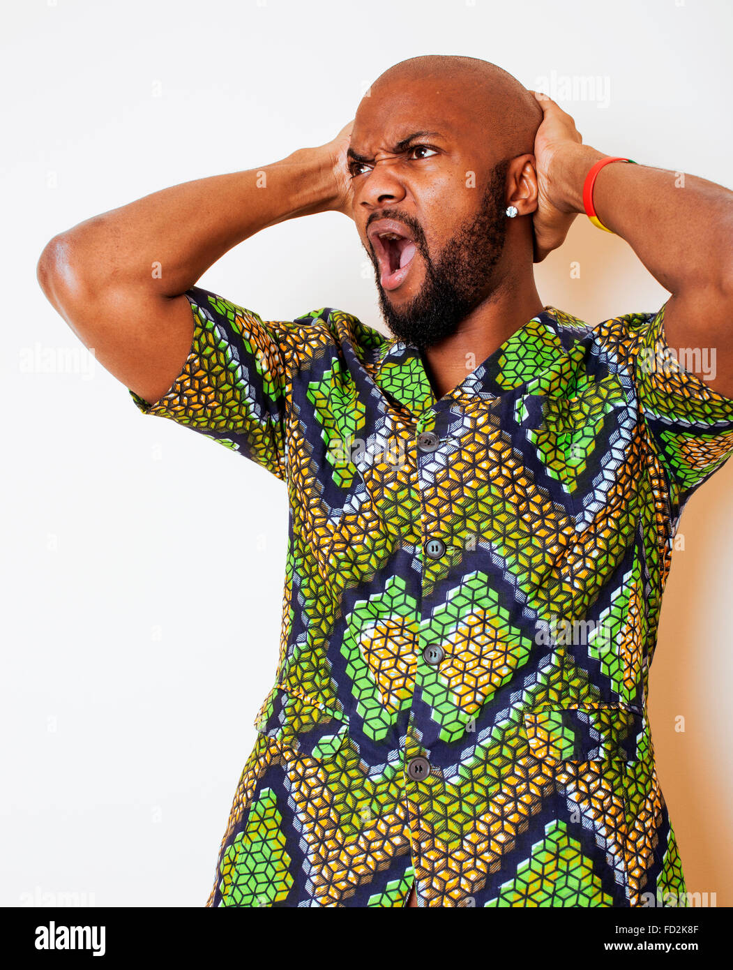 portrait of young handsome african man wearing bright green national ...